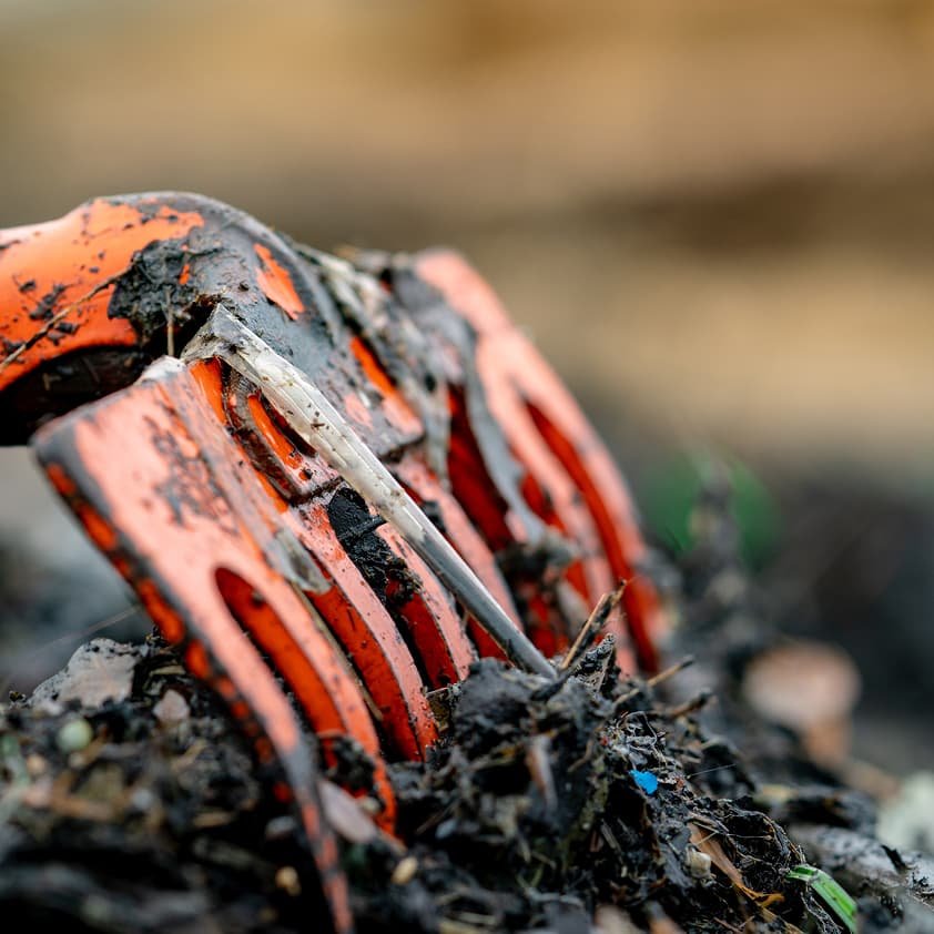 Excavator working in landfill